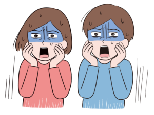 青ざめた顔で戦慄している男性と女性