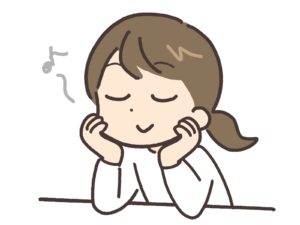 頬杖をついて鼻歌を歌っている女性