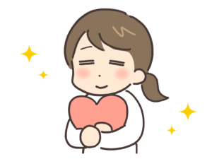 ハートを抱きしめてほっこりしている女性